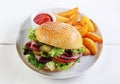 Roast beef sesame roll with French fries Royalty Free Stock Photo