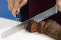 Roast beef and slice, chef `s hands cutting roast beef, Carving roast beef Royalty Free Stock Photo