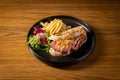 Roast Beef Sourdough Sandwich with french fries and salad served in dish isolated on table top view of thai food Royalty Free Stock Photo