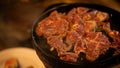 Roast beef on the stove in a pan pork shop