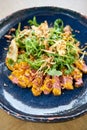 Roast beef, vegetables, carrot and oyster sauce. Sliced grilled beef barbecue Striploin steak and salad with arugula. Royalty Free Stock Photo