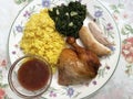 Roast Chicken Dinner With Sauce, Yellow Rice and Spinach Royalty Free Stock Photo