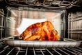 Roast chicken in the oven. Royalty Free Stock Photo