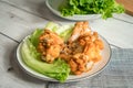 Roast chicken wring on the wooden table