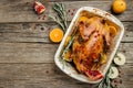 Roast Christmas duck with rosemary, thyme, berries and apples on rustic wooden table, banner, menu, recipe place for text, top Royalty Free Stock Photo