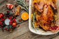 Roast Christmas duck with rosemary, thyme, berries and apples on rustic wooden table, banner, menu, recipe place for text, top Royalty Free Stock Photo