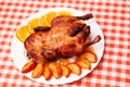 Roast duck with apples and oranges