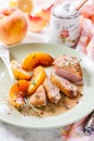 Roast duck breast with peaches