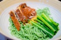 Roast duck with green noodle soup