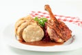 Roast duck leg with bread dumplings and red cabbage Royalty Free Stock Photo