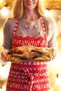 Roast duck and potato on wooden plate