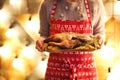 Roast duck and potato on wooden plate