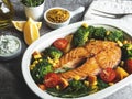 Roast, fried, baked fish steak salmon, trout with broccoli and carrots, corn in pot, top view Royalty Free Stock Photo