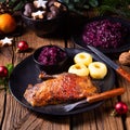Roast goose with baked apples, red cabbage and dumplings Royalty Free Stock Photo