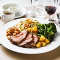 roast lamb dinner on white plate 1 Royalty Free Stock Photo