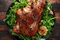 Roast Lamb leg with rosemary and garlic. on black plate, wooden table Royalty Free Stock Photo