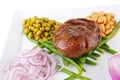 Roast meat medalion on beans Royalty Free Stock Photo