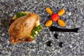 Roast partridge served with fruits salad and sauce
