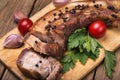 Roast pork belly with spices on a wooden board Royalty Free Stock Photo