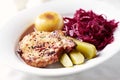Roast pork chop with potato dumplings and red cabbage Royalty Free Stock Photo