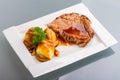 Roast pork with gravy and potatoes Royalty Free Stock Photo