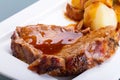 Roast pork with gravy and potatoes Royalty Free Stock Photo