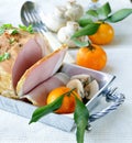 Roast pork with mushrooms and tangerines Royalty Free Stock Photo