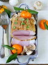Roast pork with mushrooms and tangerines Royalty Free Stock Photo
