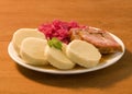 Roast pork, potato dumplings and red cabbage Royalty Free Stock Photo