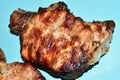 Roast pork steak with bone on a plate background