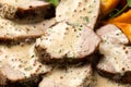 Roast Pork Tenderloin in mustard gravy with vegetables and potato wedges Royalty Free Stock Photo