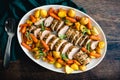 Roast Pork Tenderloin with Potatoes and Baby Carrots Royalty Free Stock Photo