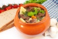 Roast in a pot with beef meat and potatoes on the table Royalty Free Stock Photo