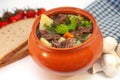 Roast in a pot with beef meat and potatoes on the table Royalty Free Stock Photo