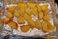 Roast potatoes being cooked in a pan
