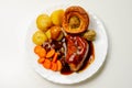 Roast potatoes and roast chicken breast in a chicken and white wine gravy with peas, carrots, pork and onion stuffing and a Royalty Free Stock Photo