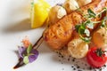 Roast salmon with potatoes on white plate. Shallow dof Royalty Free Stock Photo