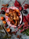 Roast spiced duck with plums