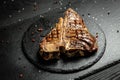 Roast T-bone or porterhouse beef meat Steak for steakhouse menu. Black background. Top view