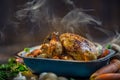 Roast whole turkey or chicken in old pan with vegetables Royalty Free Stock Photo