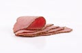 Slices perfectly arranged of roast beef on white background