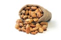 Roasted Almond nut in burlap sack on white background.