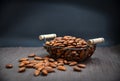 Roasted almonds in the basket and on the napkin.