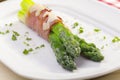 Roasted asparagus with ham and parmesan cheese Royalty Free Stock Photo