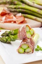 Roasted asparagus with ham and parmesan cheese Royalty Free Stock Photo