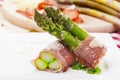Roasted asparagus with ham and parmesan cheese Royalty Free Stock Photo