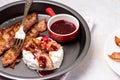 Roasted or Baked Camambert or Brie Cheese Baked with Bacon and Served with Cranberries Jam Keto Diet Royalty Free Stock Photo