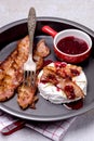 Roasted or Baked Camambert or Brie Cheese Baked with Bacon and Served with Cranberries Jam Keto Diet Top View Vertical Close Up Royalty Free Stock Photo