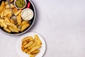 Roasted or Baked Potatoes With Spice in Black Bowl on Light Gray Background Tasty Homemade Dish Dinner Grilled Potatoes