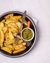 Roasted or Baked Potatoes With Spice in Black Bowl on Light Gray Background Tasty Homemade Dish Dinner Grilled Potatoes Copy Space